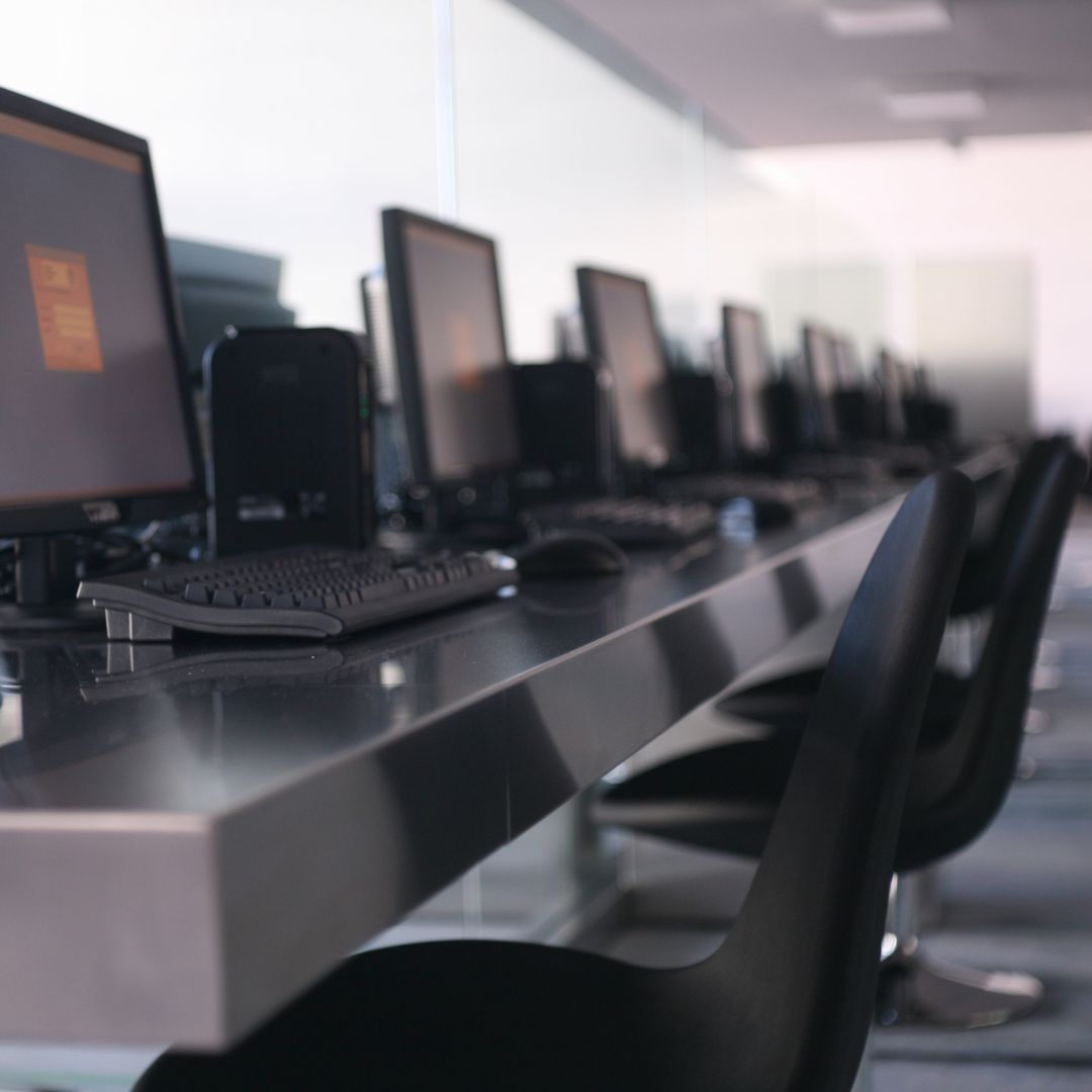 row of computer desktops