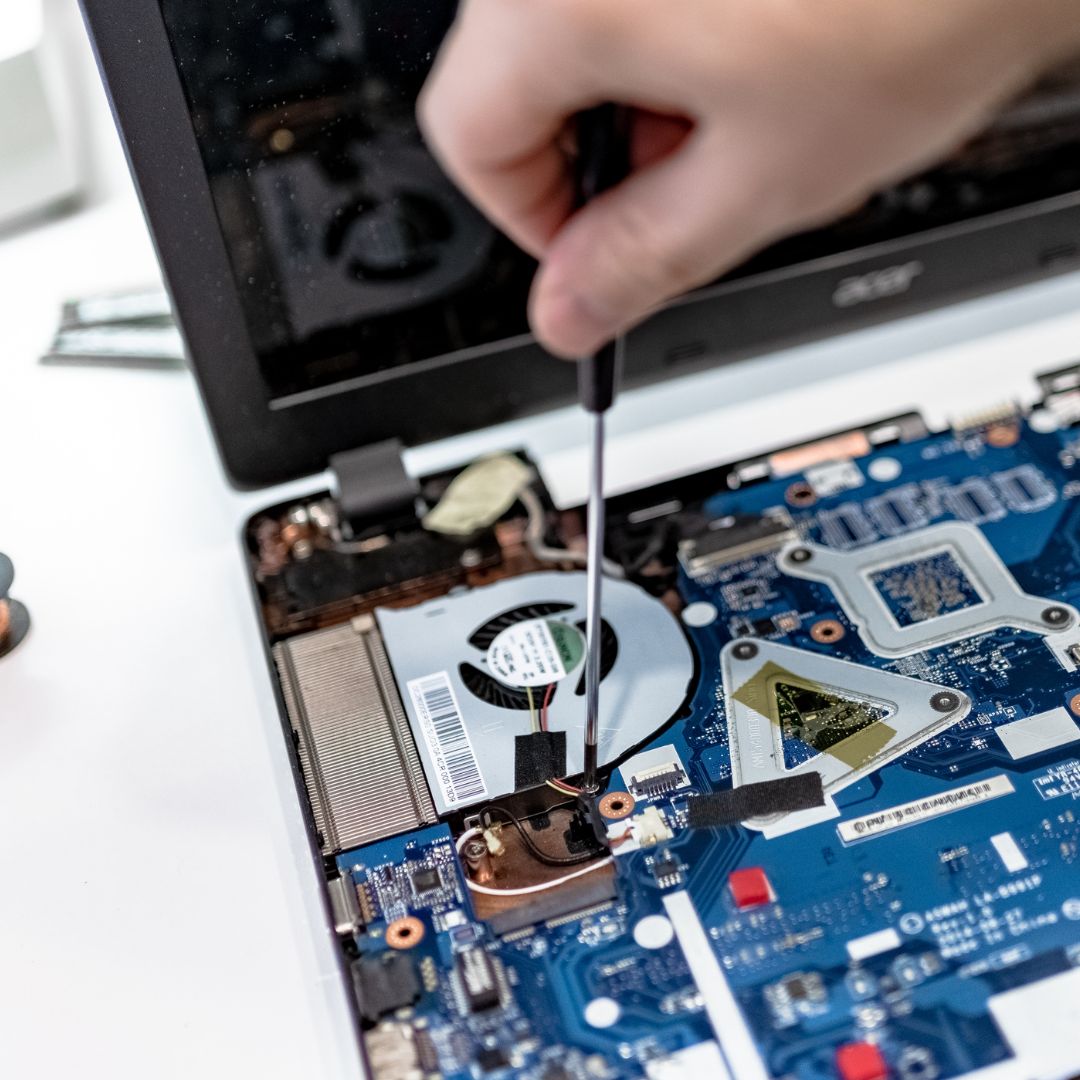 person repairing computer hardware