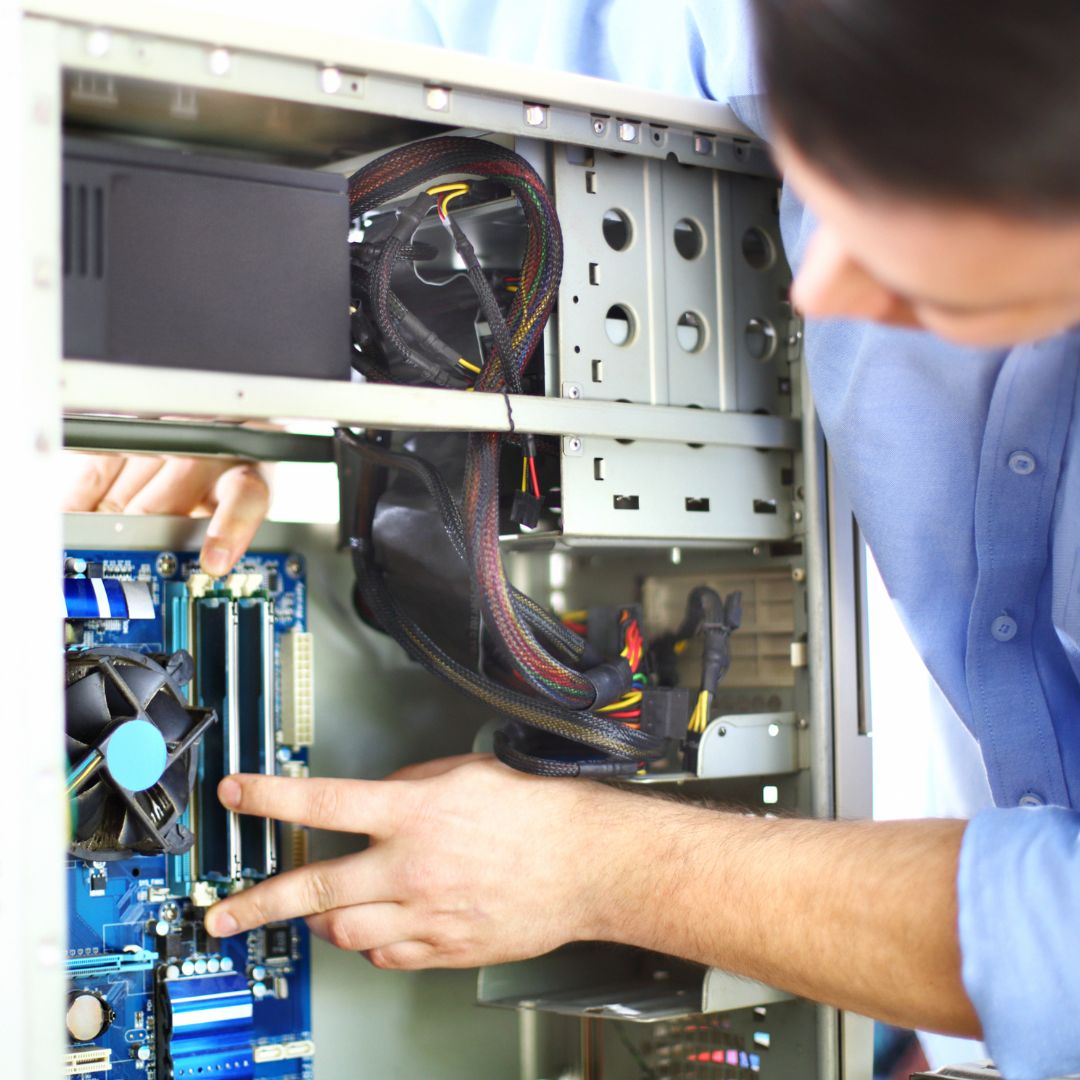 person repairing pc tower