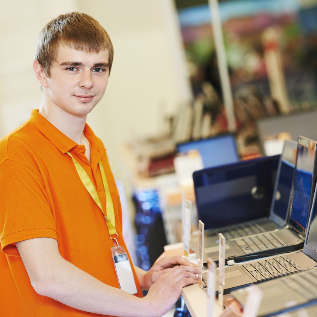 young worker at computer store