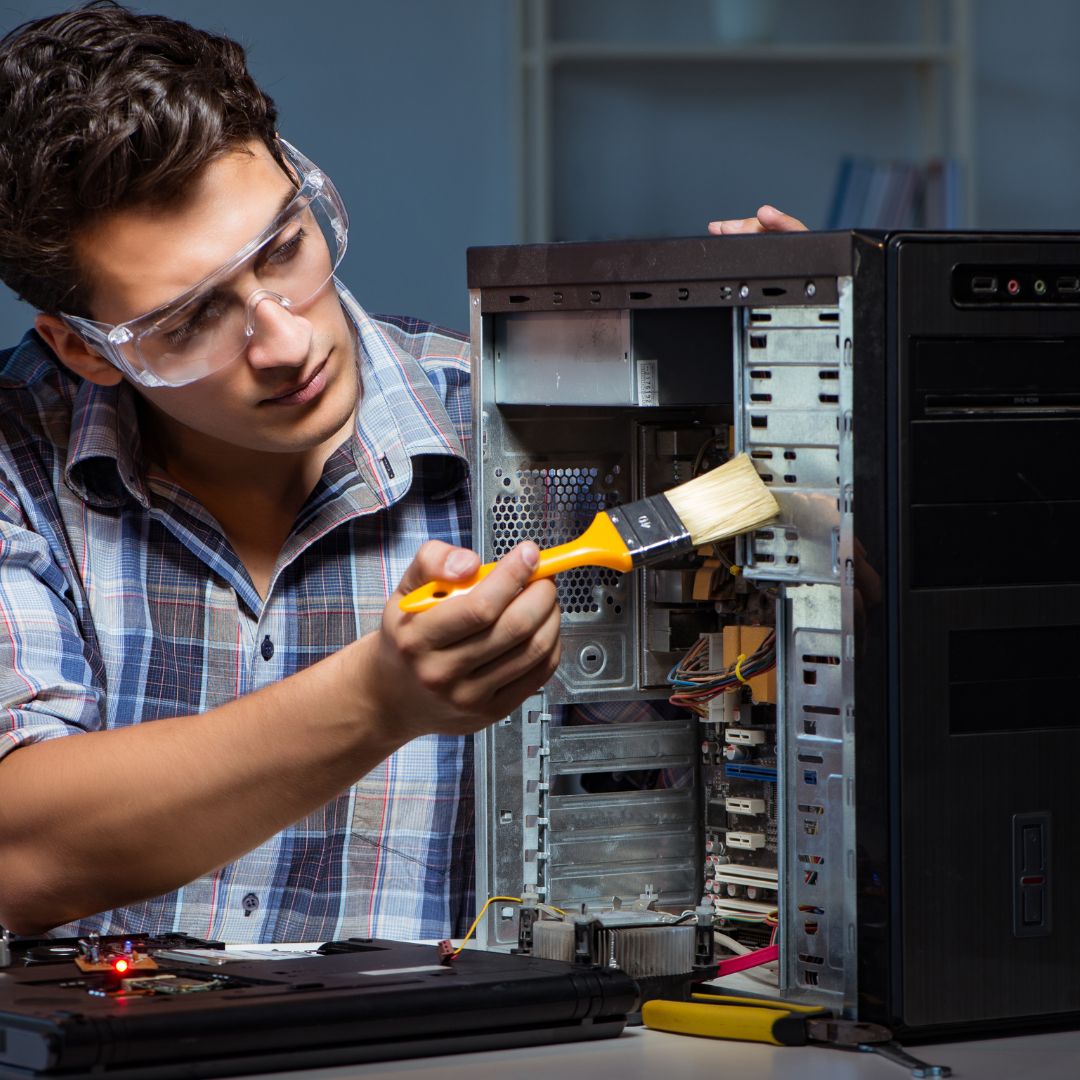 person working on pc tower